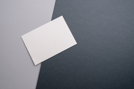 Blank business card, postcard on a colored background. Place for text and information. Mockup