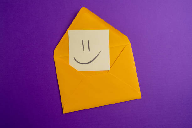 istock Paper cards with various emoticons on a colored background, banner and place for text. Conceptual image of positive thinking and satisfaction level 2053690755