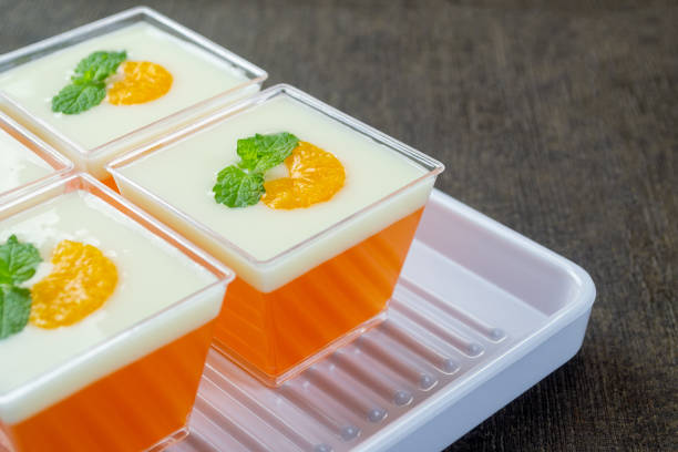 pudding mangga or mango layer pudding. topped with mango pieces and mint leaves. Very fresh and healthy