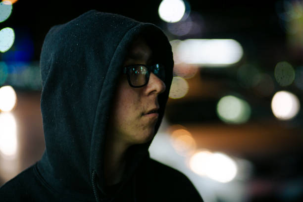 istock Hooded Young Caucasian Man at Night 2053721032