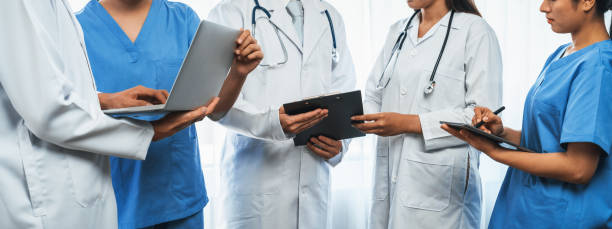 istock Confident medical staff team working together in panoramic banner. Neoteric 2053750188