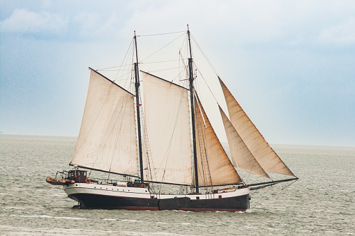 Traditional sailing ship sailing on the Wadden Sea near Vlieland, The Netherlands, 6/10/2013.