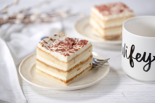 Tiramisu layered cake with coffee cup