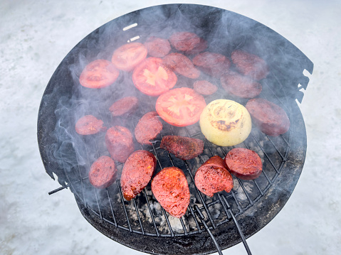 Barbecue grill on snow ground