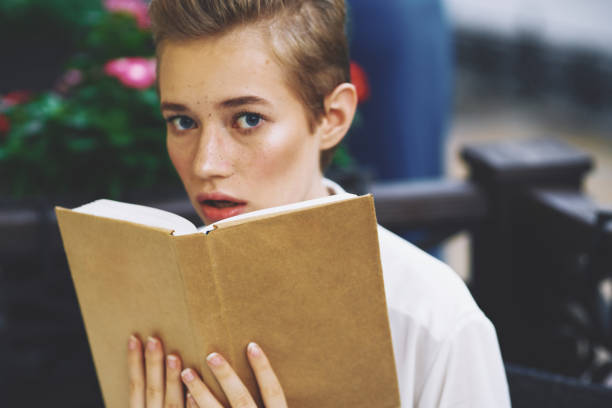 istock female in a summer cafe reading walk in the fresh air communication 2053805549