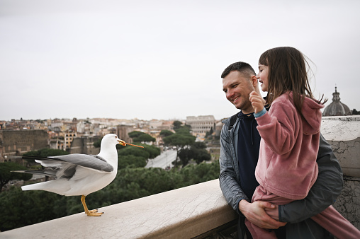 father with preschool daughter having vacations in Rome.