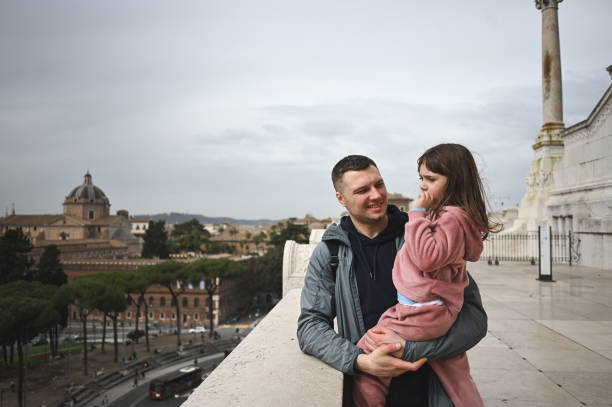 istock real family enjoying Rome cityscape. 2053811350