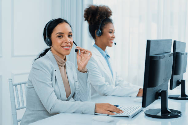 istock Business people wearing headset working in crucial office 2053840695