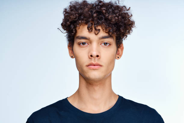 istock cute guy curly hair face close up skin care studio 2053860966