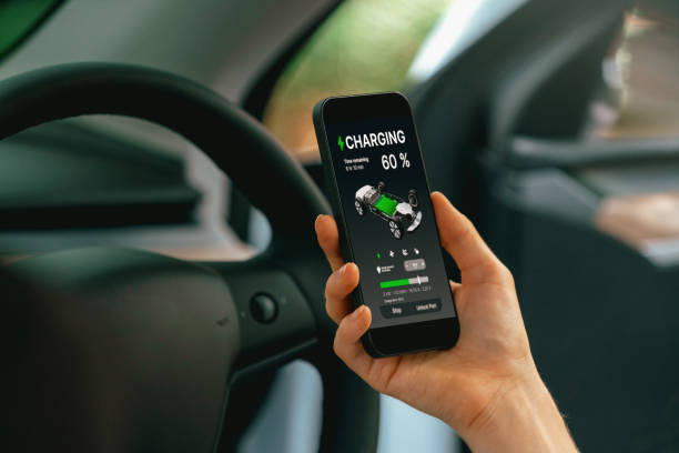 istock Young woman inside the vehicle, checking EV vehicle's application. Exalt 2053867752
