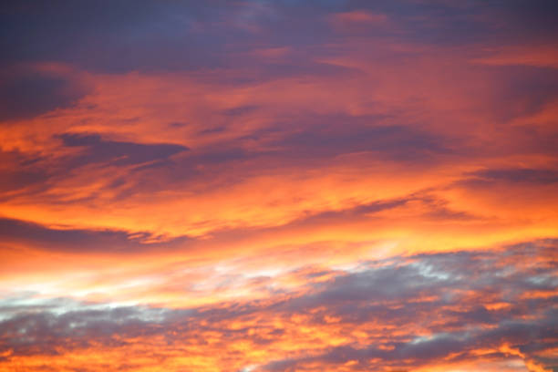 istock Tangerine Twilight: Stunning Orange Sky with Majestic Clouds 2053874538