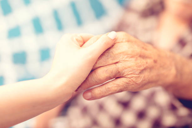 istock Woman is holding senior hand 2053898193