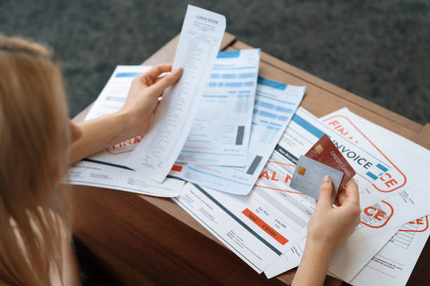 istock Stress young woman sit at at table, pay credit card debt. Blithe 2053963919