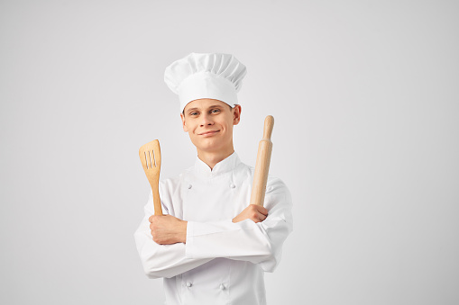 male chef in uniform restaurant work cooking. High quality photo