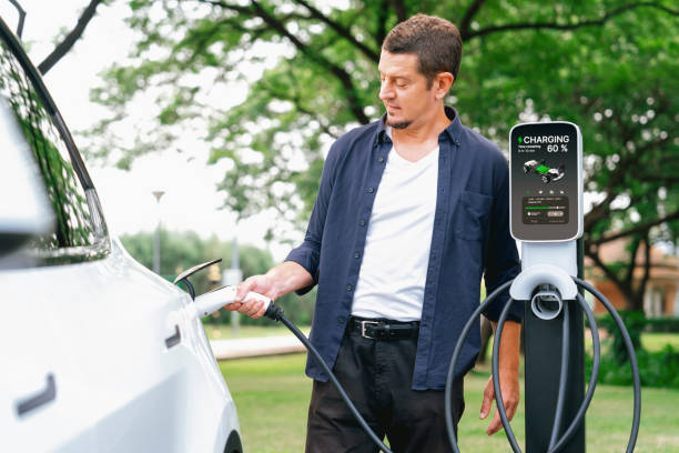 istock Man recharge EV electric vehicle battery from EV charging station. Exalt 2054076772