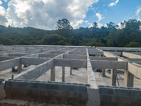 The foundation for a house under construction in Cotia, Sao Paulo, Brazil on a partly cloudy day