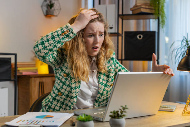 istock Frustrated business woman having software problems with laptop error or mistake virus notification 2054105022