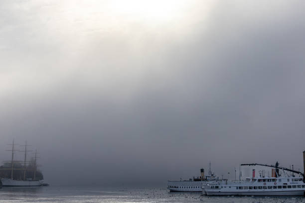 Stockholm, Sweden Feb 26, 2024 Archipelago ferries in the Stockholm harbour in the fog.
