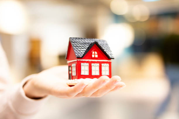 istock Model house in woman hand 2054113552