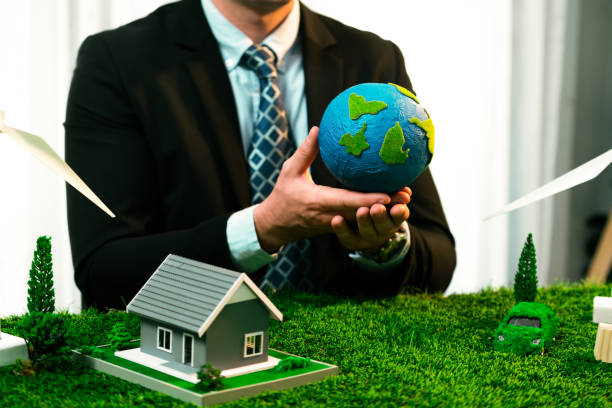 istock Businessman or CEO holding paper globe in office. Quaint 2054144625