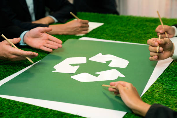 istock Recycle icon on meeting table with business people. Quaint 2054184201