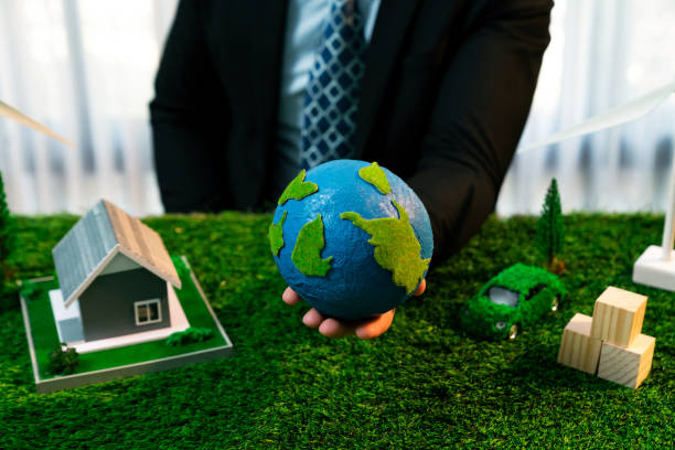 istock Businessman or CEO holding paper globe in office. Quaint 2054199308