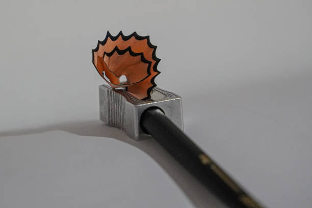 Colored pencil shavings and pencil sharpener. Drawing and office supplies