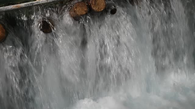Waterfall flowing from small dam