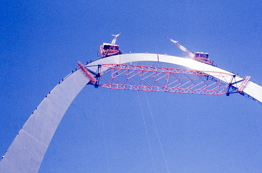 Closing the gap on Gateway Arch in Gateway Arch National Park, St. Louis, Missouri, USA October 1965. Close up of the last gap in the arch. Scanned film with significant grain, photo taken in 1965.