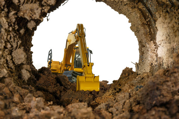 Crawler excavator yellow in the tunnel construction site.