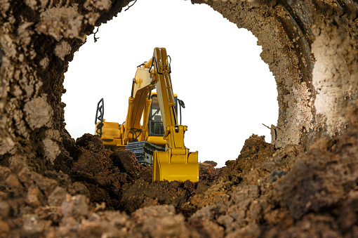 Crawler excavator yellow in the tunnel construction site. on white background