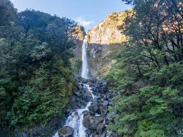 Devil's Punchbowl Waterfall amidst New Zealand's Pristine Wilderness in Arthur's Pass National Park, Southern Alps Landmarks in New Zealand