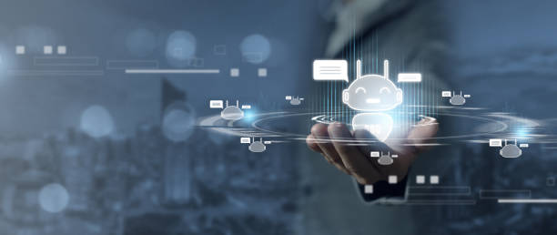 istock Businessman holds a chatbot icon automatic exchange Automated chat robot concept 2054555366
