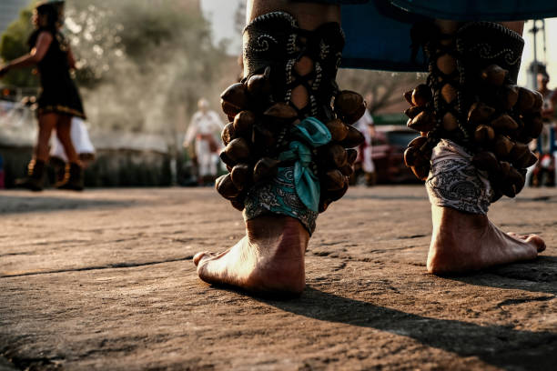 A captivating close-up of a male dancer’s feet adorned with the traditional Chilambu anklet, an essential element of Kerala’s classical and folk dance forms. The intricate metal anklet reflects cultural heritage, rhythm, and grace as the dancer prepares to perform.