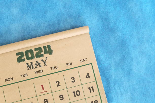 istock May 2024 calendar flat lay in blue background with copy space. 2054556947
