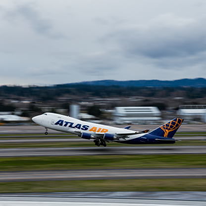 Atlas Air jet taking off at Portland international airport on a cloudy afternoon in March 2024