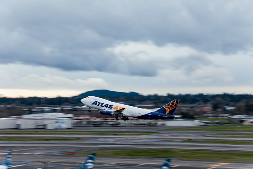 Atlas Air jet taking off at Portland international airport on a cloudy afternoon in March 2024