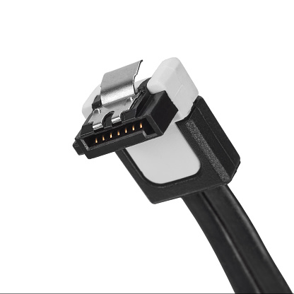 SATA connector for connecting a hard drive on a white background with shallow depth of field