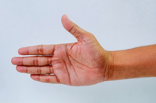 A Southeast asian men showing palm hand open gesture