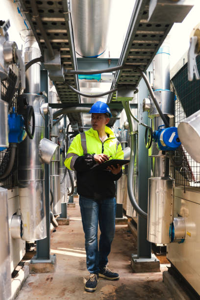 istock The smart mechanical engineer inspects the HVAC system stands for heating, ventilation, and air conditioning technology in the basement of the factory 2054629478