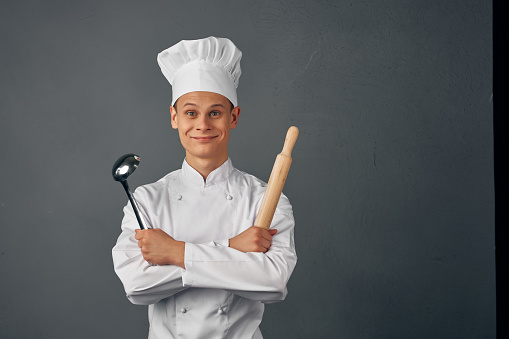 man in chef uniform kitchen appliances professional restaurant. High quality photo