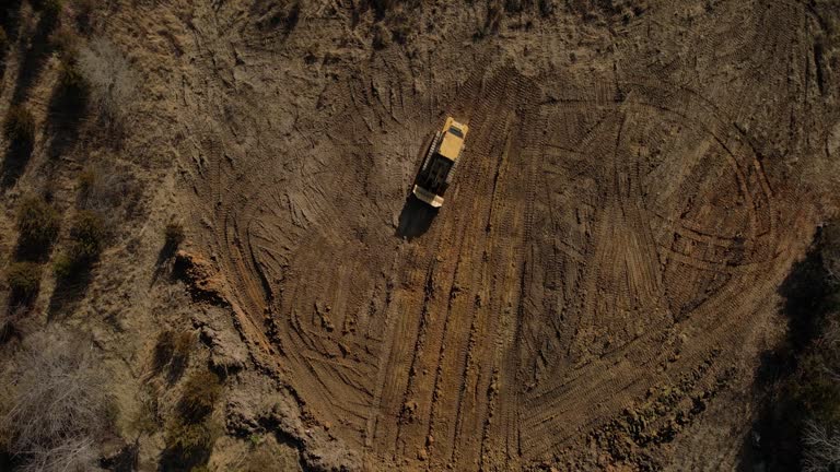 Overhead View ofHeavy Duty Earth Moving Equipment Loader Building Livestock Pond in Midwest USA Missouri Aerial Video