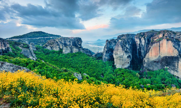 istock Dramatic view of famous Eastern Orthodox monasteries listed as a World Heritage site, built on top of rock pillars. Incredible spring sunset of Kalabaka location, Trikala regional unit, part of Thessaly, Greece. 2054662286