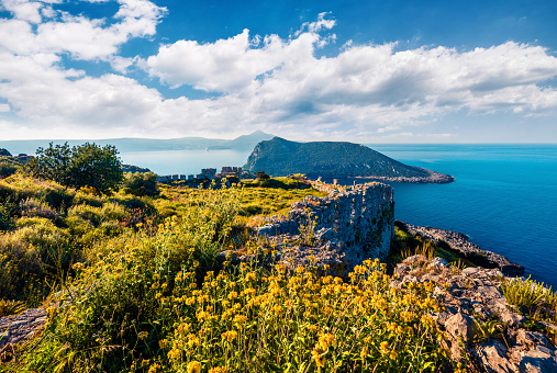 Colorful spring view of the Navarino Castle. Sunny morning scene of the Ionian Sea, Pylos town location, Peloponnese, Greece, Europe. Beauty of nature concept background.