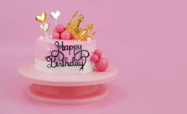 istock Pink birthday cake with gold crown with copy space 2054720907