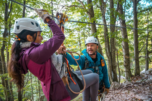 istock Diverse Group Enjoying Zipline Adventure in Forest 2054798430
