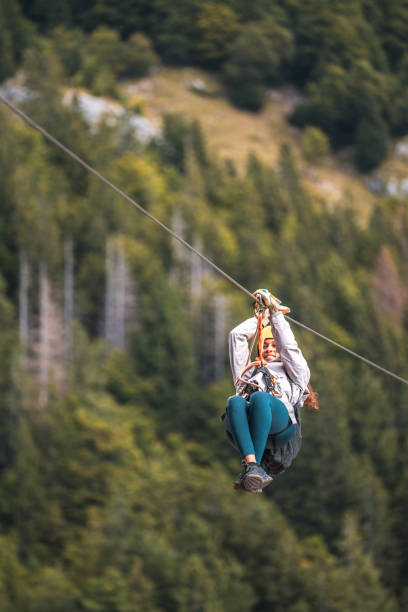 istock Female Adventurer on Zip Line in Forest 2054798452