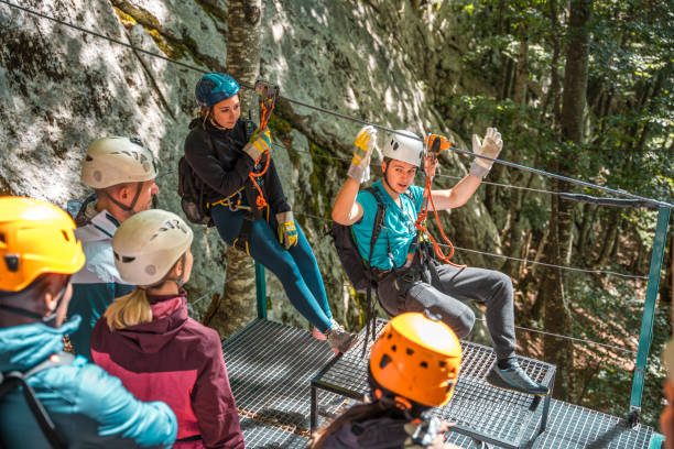 istock Experienced Zipline Coach Demonstrating Finesse And Skill Ensuring Each Participant Feels Empowered And Ready For Exhilarating Flight 2054800543