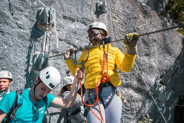 istock Happy Young Black Female Getting Ready For A High-altitude Zip-lining Journey With Professional Gear 2054802675