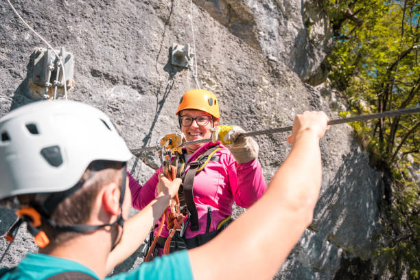 istock Happy Caucasian Woman Getting Ready For A Mountain Peak Ziplining With A Harmonious Blend Of Thrill And Natural Beauty 2054802693